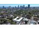Wide aerial shot of a quaint two-story apartment complex in an urban neighborhood with the city skyline in the background at 525 9Th N Ave # 2, St Petersburg, FL 33701