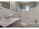 Bathroom with a white vanity, updated fixtures, and a shower-tub combination at 525 9Th N Ave # 2, St Petersburg, FL 33701