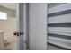 Bathroom doorway with a view of the shower/tub, toilet, and a built in storage closet at 525 9Th N Ave # 2, St Petersburg, FL 33701