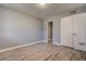 Empty bedroom featuring wood-look floors and a closet at 525 9Th N Ave # 2, St Petersburg, FL 33701
