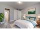 Cozy bedroom featuring gray walls, wood-style flooring, and access to an ensuite bathroom at 525 9Th N Ave # 2, St Petersburg, FL 33701