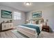 Stylish bedroom featuring hardwood floors, a comfy queen bed, and trendy decor at 525 9Th N Ave # 2, St Petersburg, FL 33701