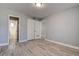 Bedroom with hardwood flooring, ensuite bath, and a double-door closet at 525 9Th N Ave # 2, St Petersburg, FL 33701