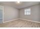 Bright and airy bedroom with wood-look floors, a neutral color palette, and ample natural light at 525 9Th N Ave # 2, St Petersburg, FL 33701
