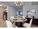 Stylish dining room with modern table and elegant chandelier at 525 9Th N Ave # 2, St Petersburg, FL 33701