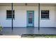 Charming front entry with a blue door, black support beams, and symmetrical windows at 525 9Th N Ave # 2, St Petersburg, FL 33701