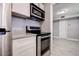 Well-equipped kitchen with stainless steel oven and countertop microwave at 525 9Th N Ave # 2, St Petersburg, FL 33701