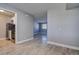 Open living space with wood-look floors and a view into the kitchen and separate room at 525 9Th N Ave # 2, St Petersburg, FL 33701