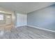 Bare living room with wood-look floors and a closet at 525 9Th N Ave # 2, St Petersburg, FL 33701
