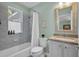 Bathroom with a shower-tub combo, and a vanity with stone countertops and sink at 5913 Flatwoods Manor Cir, Lithia, FL 33547