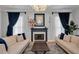 Inviting living room showcasing a fireplace and coordinated decor with hardwood flooring and lots of light at 5913 Flatwoods Manor Cir, Lithia, FL 33547