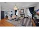 Elegant living room with hardwood floors, fireplace, and stylish decor at 5913 Flatwoods Manor Cir, Lithia, FL 33547