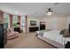 Relaxing main bedroom with carpeted floor, light-colored walls, and comfortable seating area at 5913 Flatwoods Manor Cir, Lithia, FL 33547