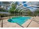 Inviting private screened-in pool features tile surround and integrated spa at 5913 Flatwoods Manor Cir, Lithia, FL 33547