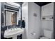 Chic powder room with modern fixtures, stylish sink, and unique decor at 5913 Flatwoods Manor Cir, Lithia, FL 33547
