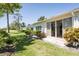 Back exterior featuring lawn and patio area at 6208 Country Club Way, Sarasota, FL 34243