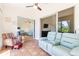 Bright sunroom with terracotta tile, comfortable seating, and access to other rooms at 6208 Country Club Way, Sarasota, FL 34243