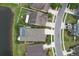 Aerial view of the property with a pool, landscaping, and the surrounding neighborhood at 6303 Hawk Grove Ct, Wesley Chapel, FL 33545