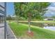 A tree lined pond is visible from the backyard, offering a serene backdrop for outdoor enjoyment at 6303 Hawk Grove Ct, Wesley Chapel, FL 33545