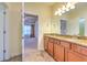 Bathroom with granite counters, tiled floor, and view into bedroom at 6303 Hawk Grove Ct, Wesley Chapel, FL 33545