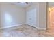 Neutral toned bedroom featuring tile floors and closet at 6303 Hawk Grove Ct, Wesley Chapel, FL 33545