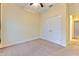 Bedroom with double closet, carpet flooring, and ceiling fan at 6303 Hawk Grove Ct, Wesley Chapel, FL 33545