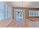 Breakfast area featuring tile floors, plantation shutters, and French doors at 6303 Hawk Grove Ct, Wesley Chapel, FL 33545