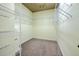 Walk-in closet with carpet flooring and wire shelving at 6303 Hawk Grove Ct, Wesley Chapel, FL 33545