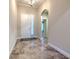 Elegant foyer features stylish tile flooring and a bright, welcoming atmosphere at 6303 Hawk Grove Ct, Wesley Chapel, FL 33545