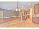 Open kitchen with island, stainless steel appliances, and eat in breakfast area at 6303 Hawk Grove Ct, Wesley Chapel, FL 33545