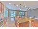 Kitchen island with stainless steel appliances, granite countertops, and pendant lighting at 6303 Hawk Grove Ct, Wesley Chapel, FL 33545