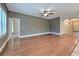 Spacious living room featuring hardwood floors and neutral color palette, perfect for relaxing or entertaining at 6303 Hawk Grove Ct, Wesley Chapel, FL 33545