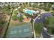 Aerial view of the community pool, basketball court, playground and parking spaces at 6303 Hawk Grove Ct, Wesley Chapel, FL 33545