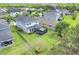 Aerial view of the home featuring a large backyard with an enclosed patio at 6518 Salt Creek Ave, Apollo Beach, FL 33572