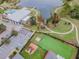 Aerial view of the community center, a playground, a green space, and a lake view at 6518 Salt Creek Ave, Apollo Beach, FL 33572