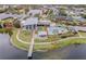 Community pool and clubhouse with a lake view and lounge area at 6518 Salt Creek Ave, Apollo Beach, FL 33572