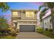 Well-maintained two-story home with a two-car garage and manicured landscaping at 6518 Salt Creek Ave, Apollo Beach, FL 33572