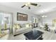 Cozy living room and dining area provide a welcoming atmosphere with neutral decor at 6518 Salt Creek Ave, Apollo Beach, FL 33572