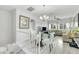 Bright, open-concept living room and dining area feature sleek flooring and abundant natural light at 6518 Salt Creek Ave, Apollo Beach, FL 33572