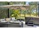 Relax in this screened outdoor patio with a spacious seating area and a luxurious hot tub at 6518 Salt Creek Ave, Apollo Beach, FL 33572