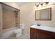 Bathroom featuring tile floors, a shower-tub combo, and a single sink vanity at 7020 Oakview Cir, Tampa, FL 33634