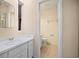 Bathroom with a single sink vanity, ceramic tile floors, and a toilet at 7020 Oakview Cir, Tampa, FL 33634