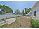 Spacious backyard features a hammock, patio, and white privacy fence, perfect for outdoor living at 7491 Cedar Ne St, St Petersburg, FL 33702