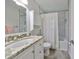Updated bathroom with marble tile, modern fixtures, and a bathtub/shower combination at 7491 Cedar Ne St, St Petersburg, FL 33702