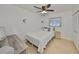 Cozy bedroom with a single bed, natural light, light colored walls, and a ceiling fan at 7491 Cedar Ne St, St Petersburg, FL 33702