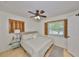 Bright bedroom featuring natural light, hardwood floors, ceiling fan, and neutral paint at 7491 Cedar Ne St, St Petersburg, FL 33702