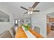 Inviting dining room features wood table, stylish chairs, and modern ceiling fan, perfect for Gathering meals and entertaining at 7491 Cedar Ne St, St Petersburg, FL 33702