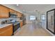Bright kitchen with stainless steel appliances, ample counter space, tile flooring, and a cozy breakfast bar area at 7491 Cedar Ne St, St Petersburg, FL 33702
