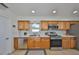 Charming kitchen with stainless steel appliances, tile flooring, and bright marble countertops at 7491 Cedar Ne St, St Petersburg, FL 33702