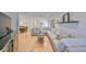 Spacious living room with a large sectional sofa, hardwood floors and bright natural light at 7491 Cedar Ne St, St Petersburg, FL 33702